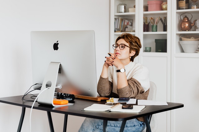 A photo of a woman using laptop could be possibly searching for B2B Lead Generation Techniques 